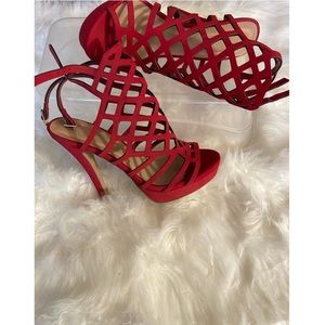 Red open toe heels with ankle strap, size 7.